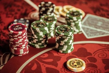hasil cambodia live dealer handling cards and chips at a baccarat table